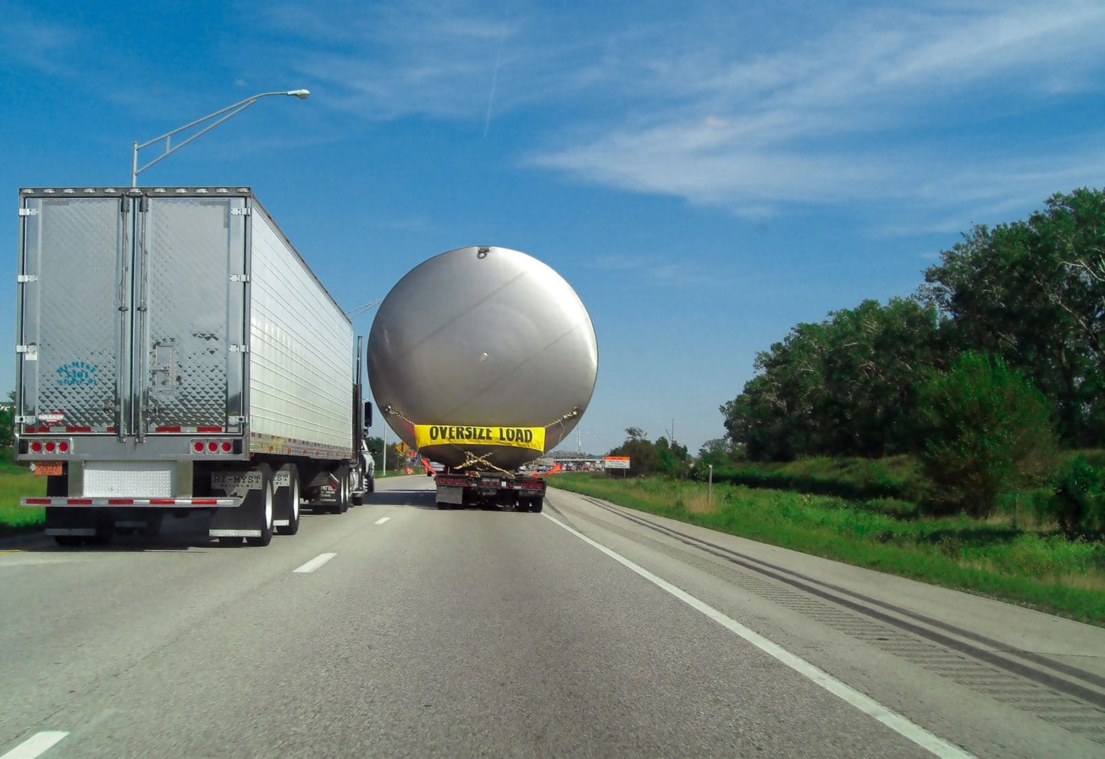 An oversize load travelling under escort on a US highway